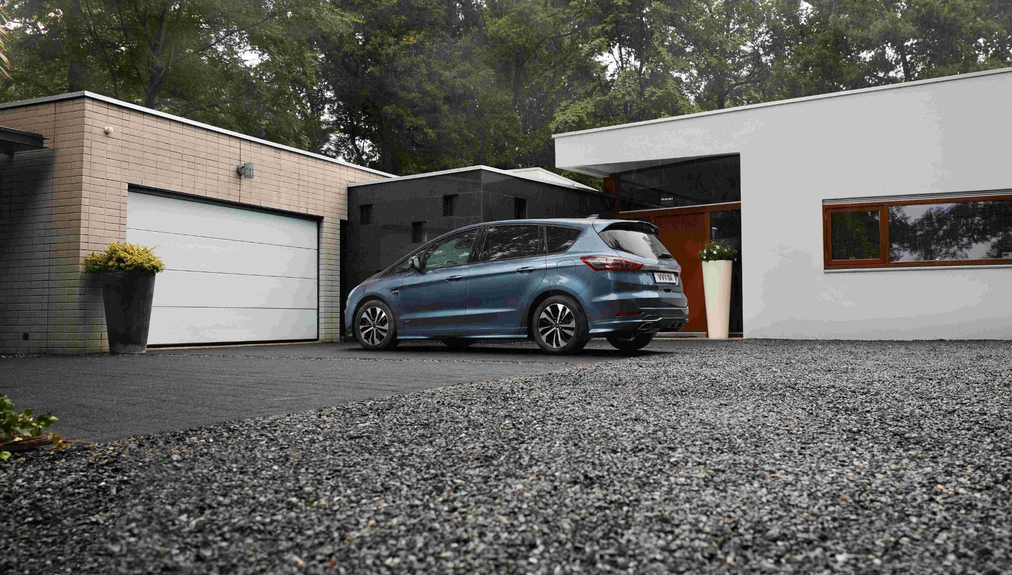 Blue Ford Max 6 Parked In Front of the Building