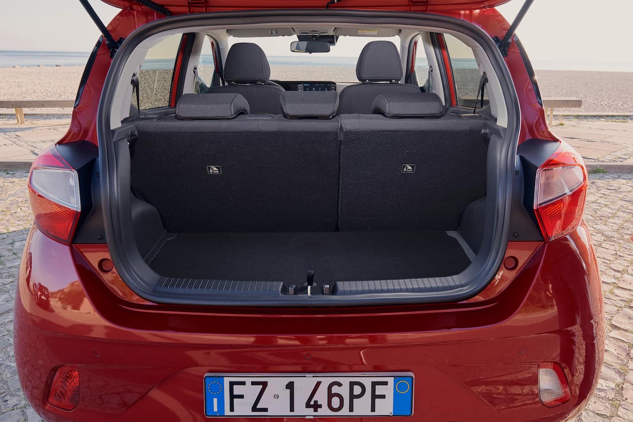 inside the open boot of a red hyundai i10