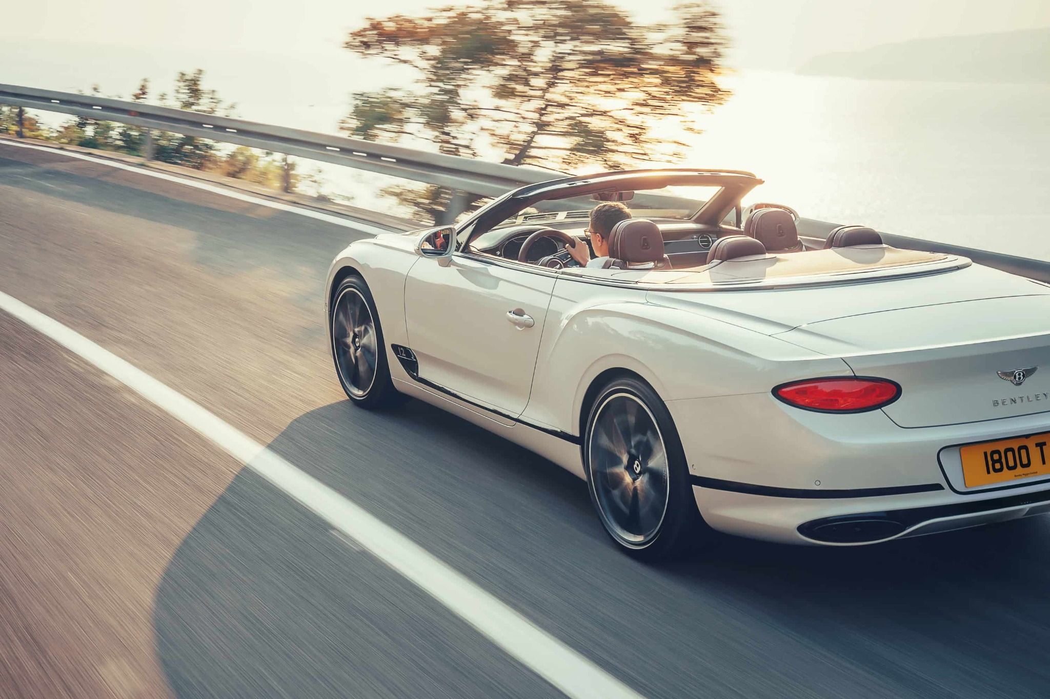 bentley continental gt convertible driving with the roof down