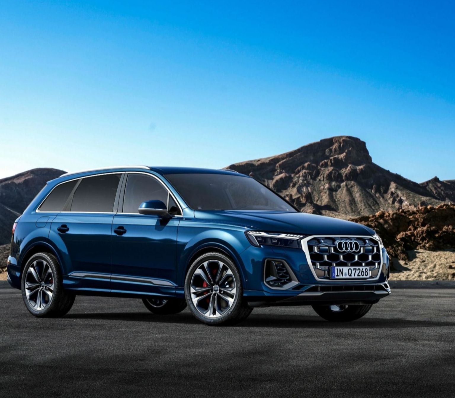 Image of Audi Parked Up in Front of Mountainous Landscape