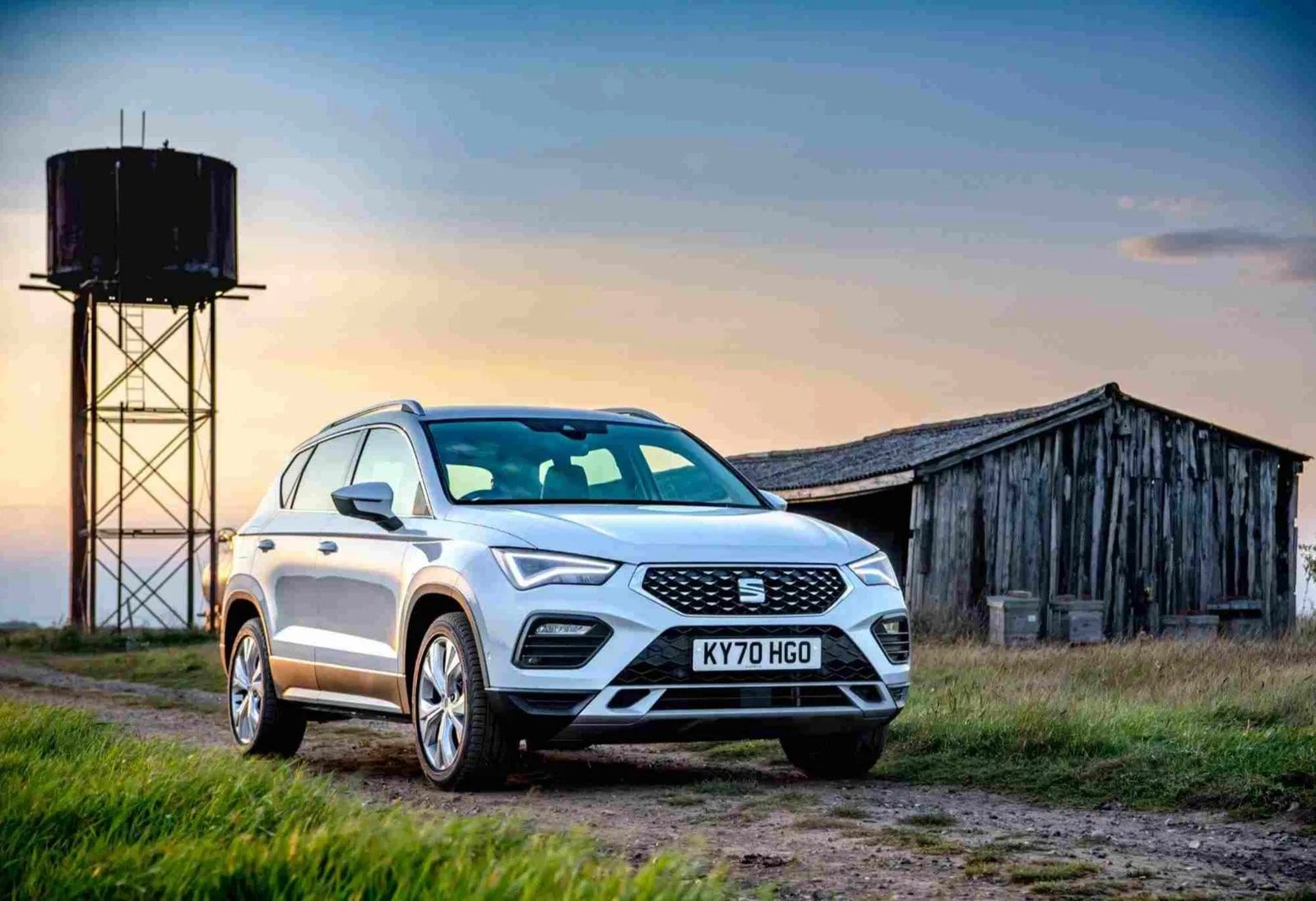 Grey SEAT Ateca pictured outside barn