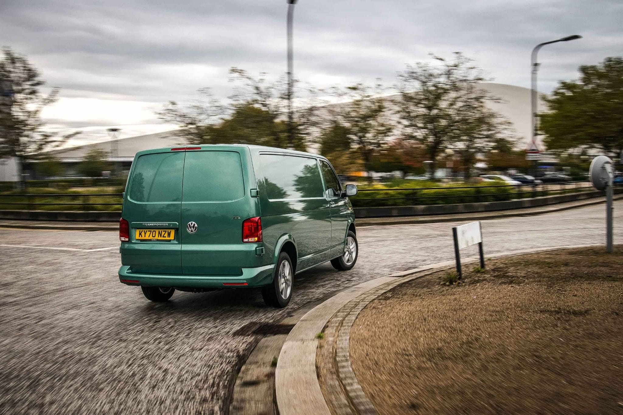 Volkswagen Van Driving Round A Corner