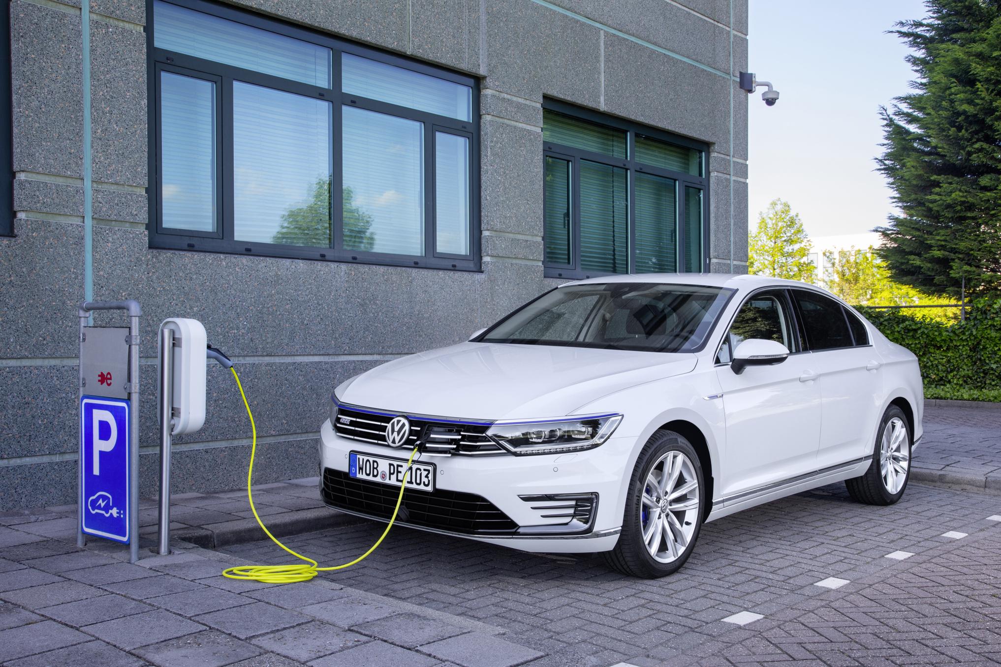 VW Passat GTE hybrid car on charge outside an office